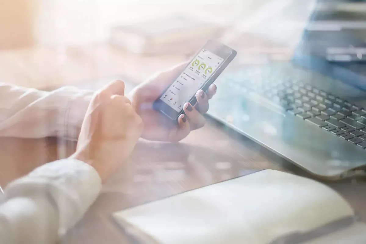 myFICO_app_0 copy.jpg Person checking their FICO Score on their phone
