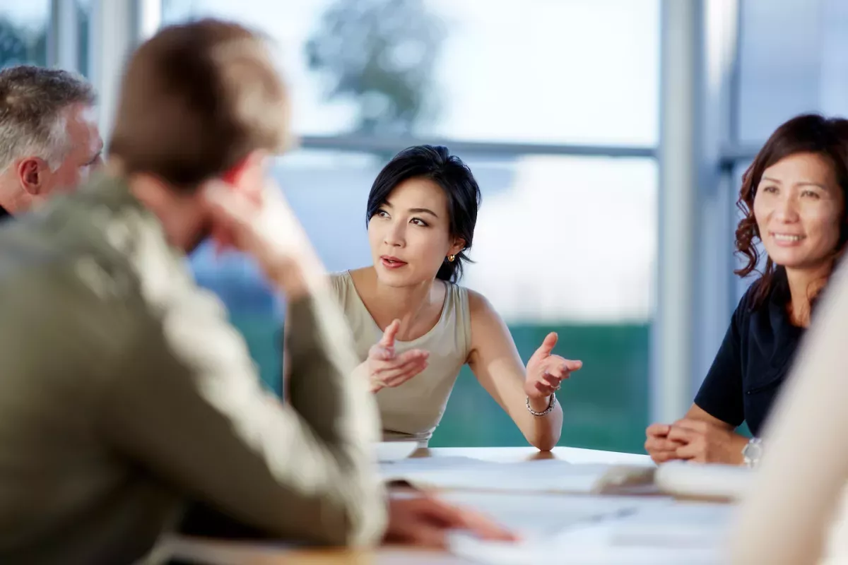 AdobeStock_357285962.jpeg Business woman presenting to a team