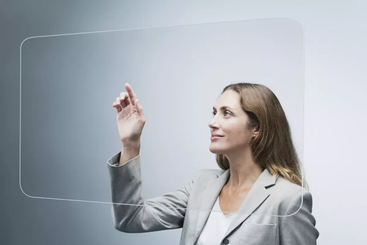 GettyImages-153349291.jpg Woman using a glass touch screen