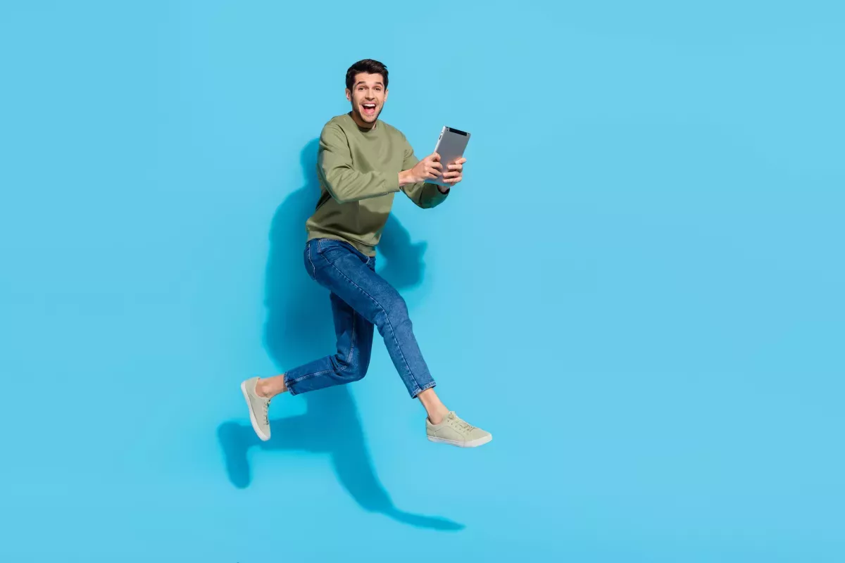 man-tablet-run.jpeg Man with tablet running