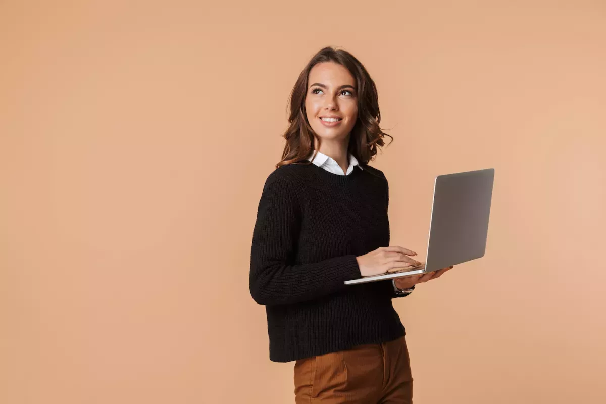 woman holding laptop