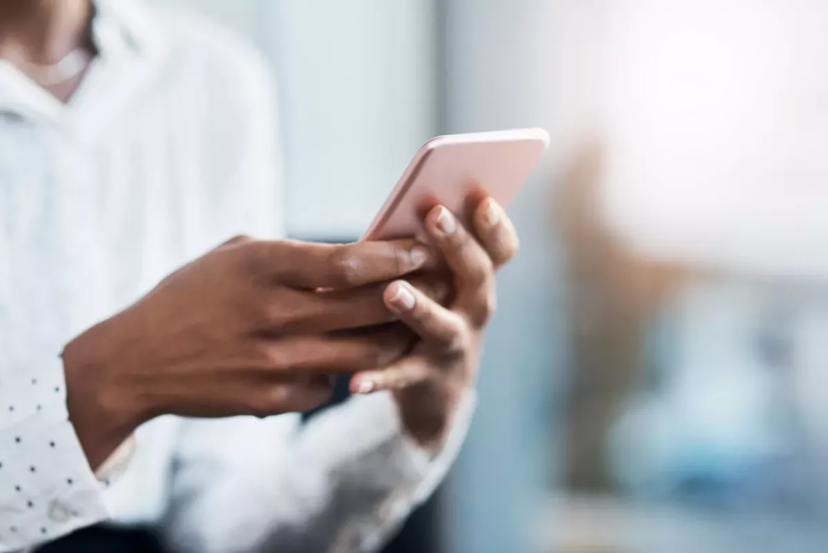 two hands holding a cellphone