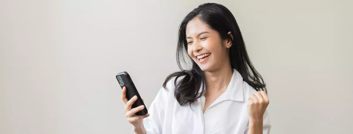 woman looking at cell phone