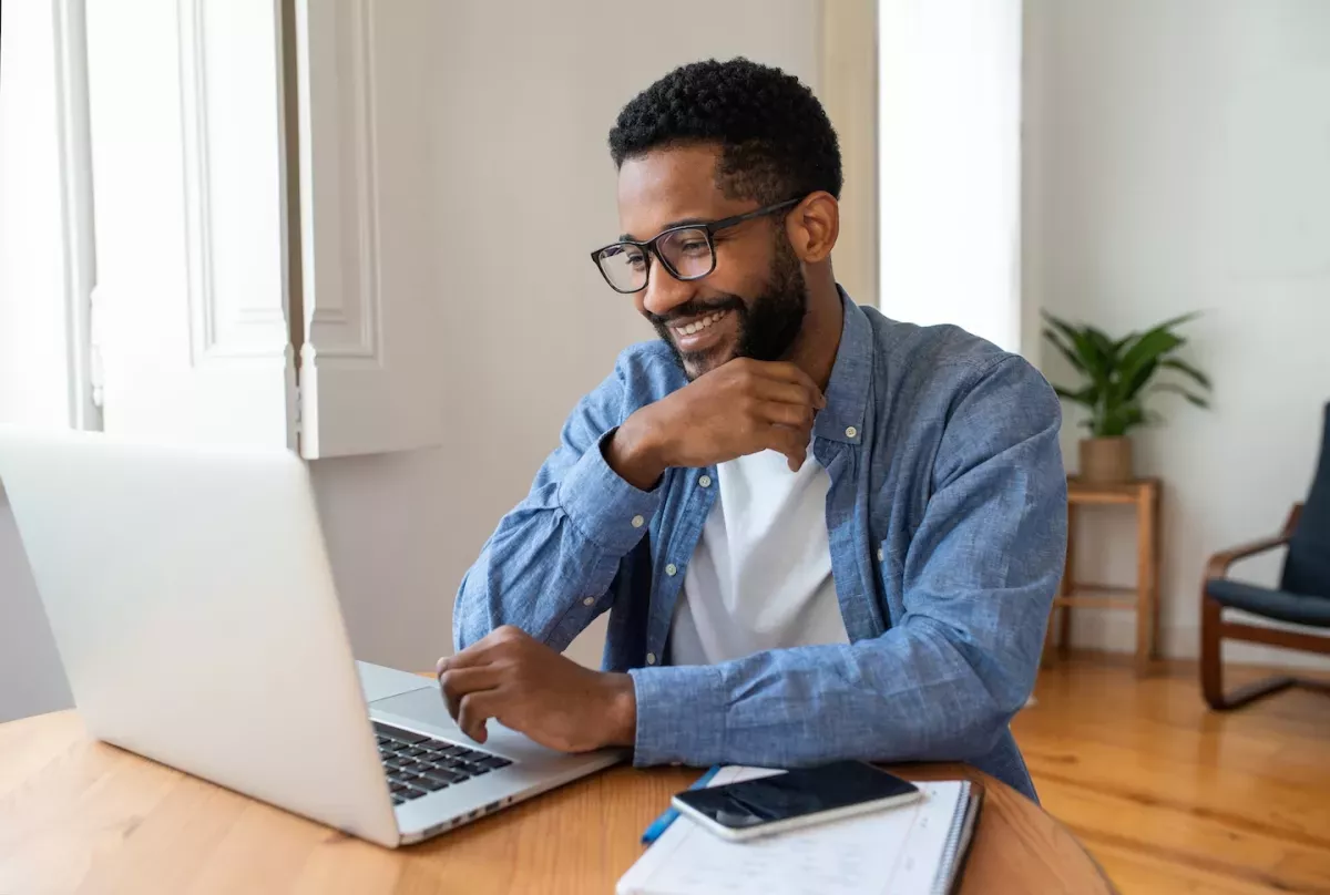 man looking at computer