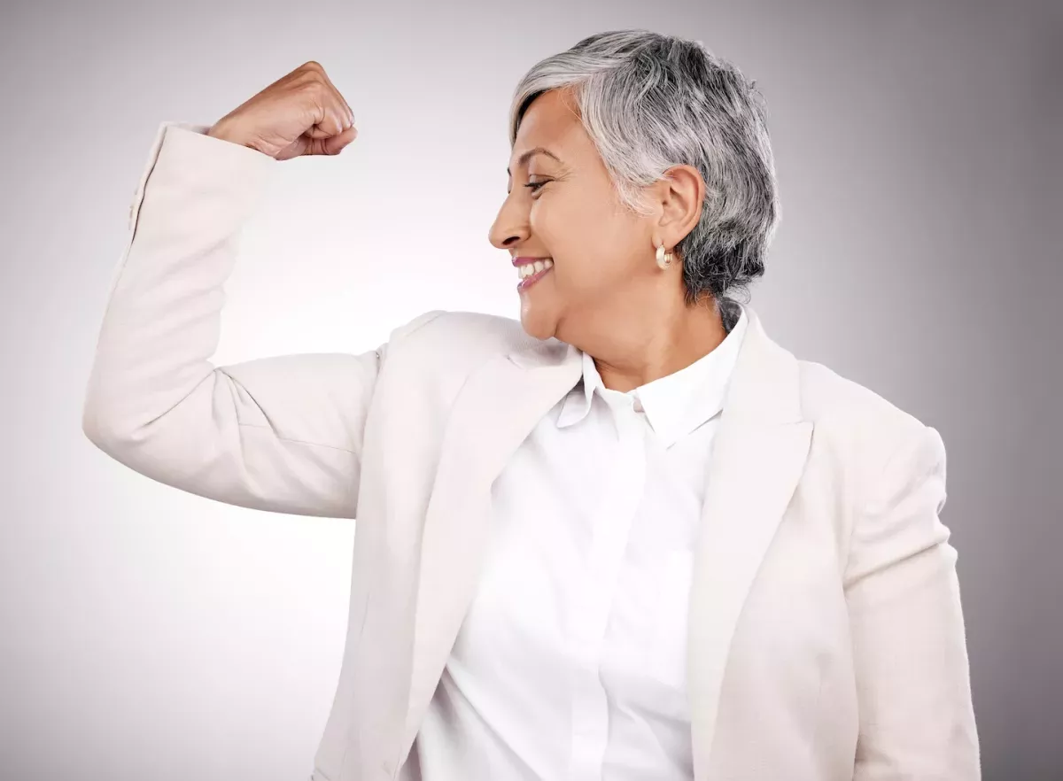 Looking at arm muscle and smiling