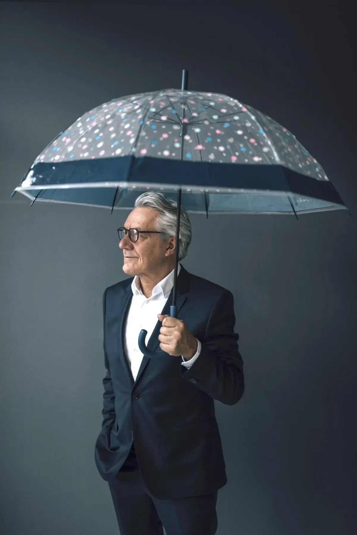 Man with umbrella in suit