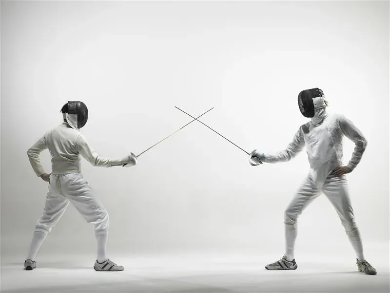 Two people fencing Two people fencing
