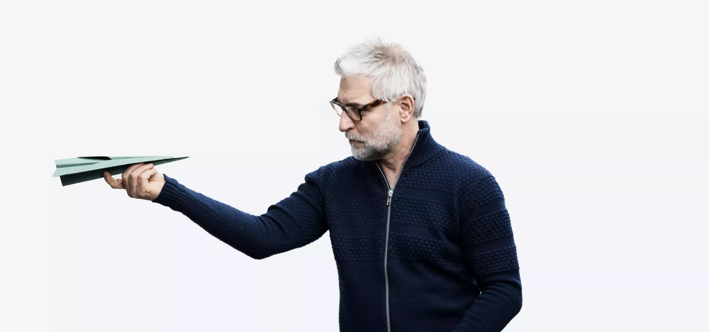 Airplane.png Man looking at a paper airplane