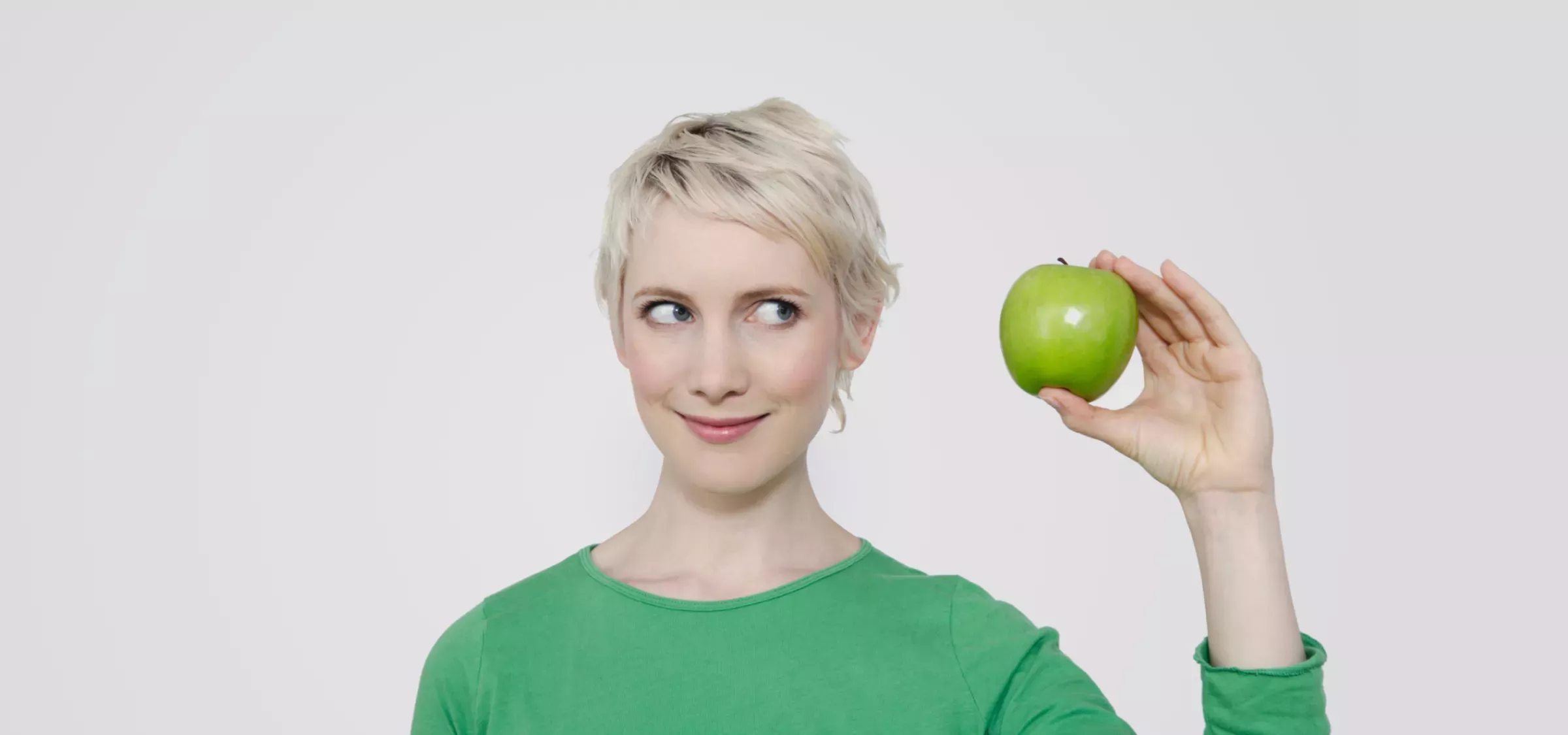 Core.png Woman holding an apple