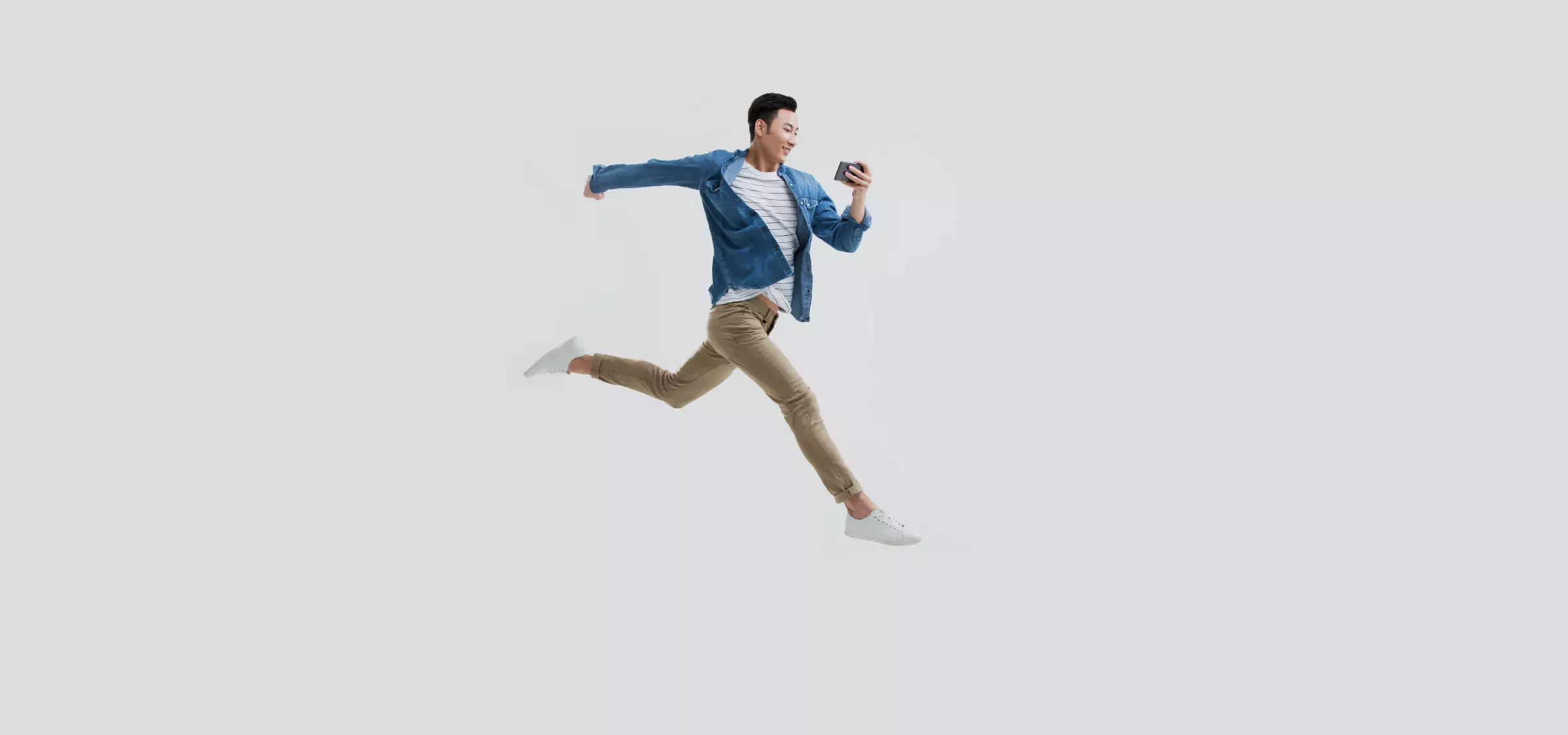 Jumping.png Man jumping looking at phone