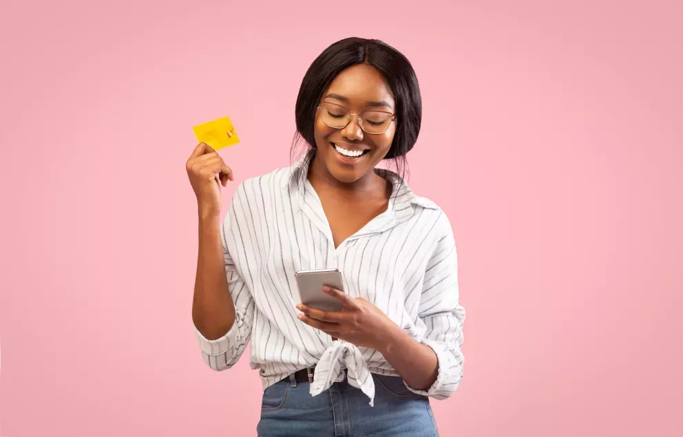 Woman using mobile banking app on cell phone