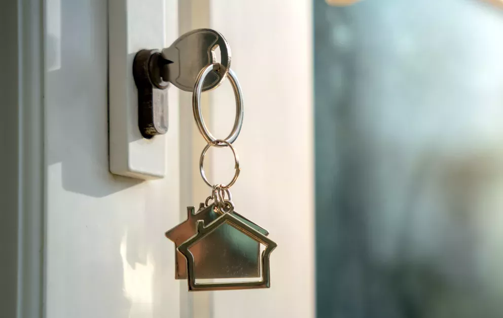 close up of house keys in door