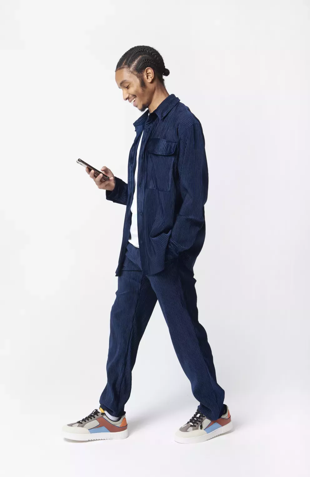 person walking using cell phone