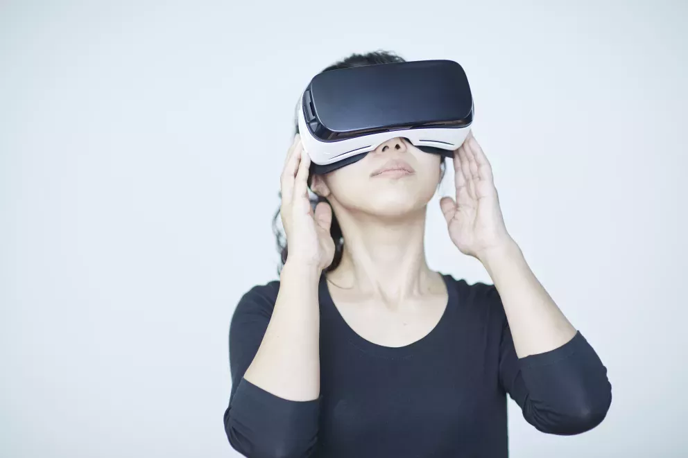 person using virtual reality headset person using virtual reality headset