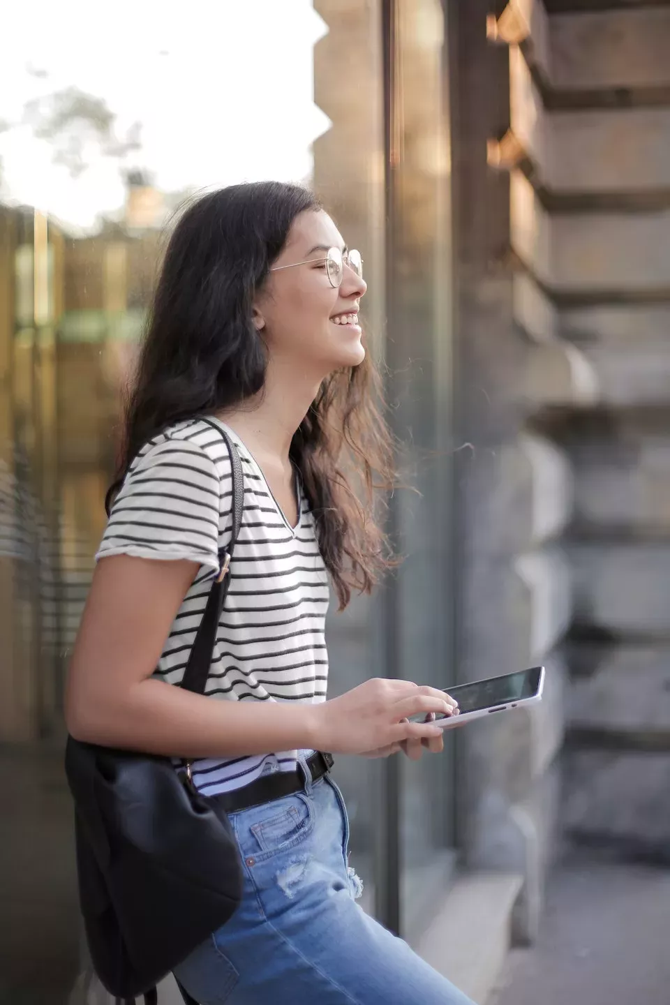 Happy woman checking her phone