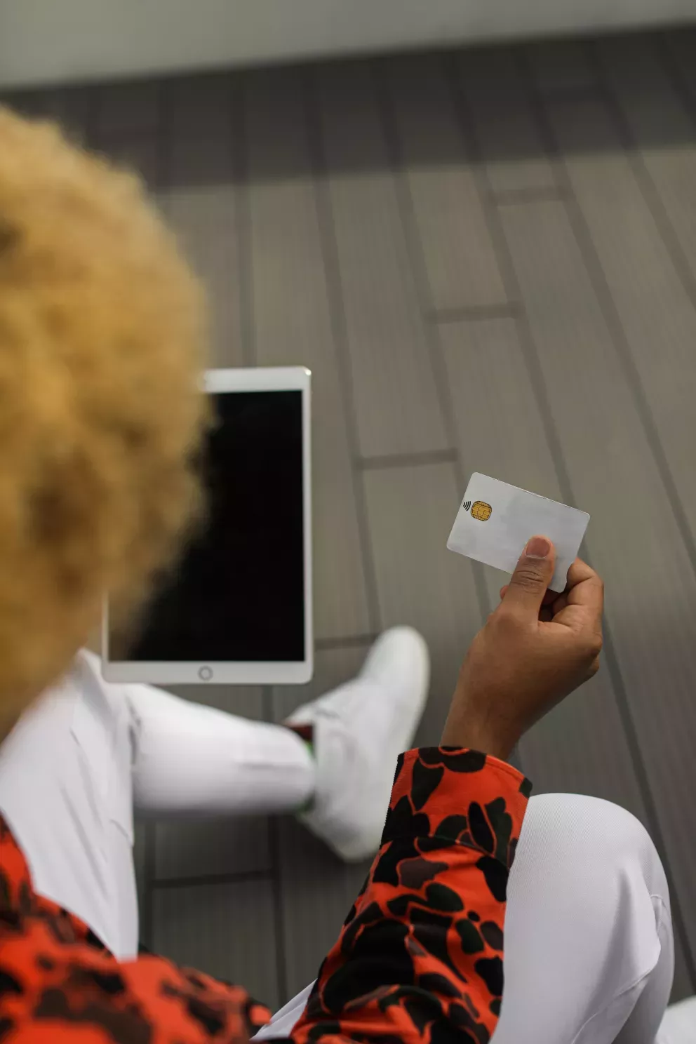 close up of person shopping on tablet with a credit card close up of person shopping on tablet with a credit card