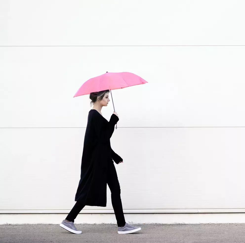 Woman walking with an umbrella