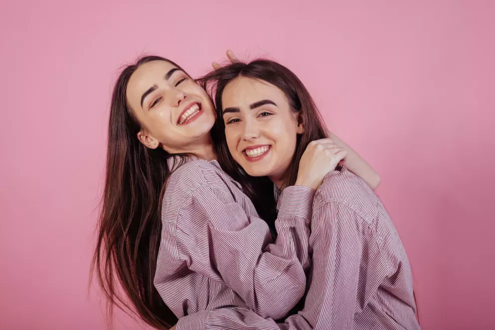 Twins hugging each other Twins hugging each other
