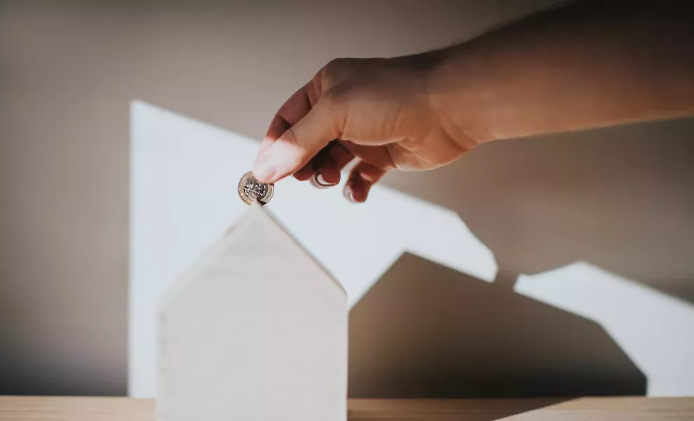 Putting a coin into savings Putting a coin into savings