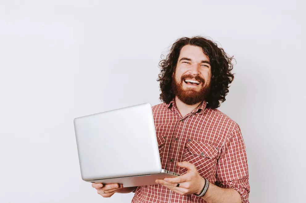 smiling man using laptop smiling man using laptop