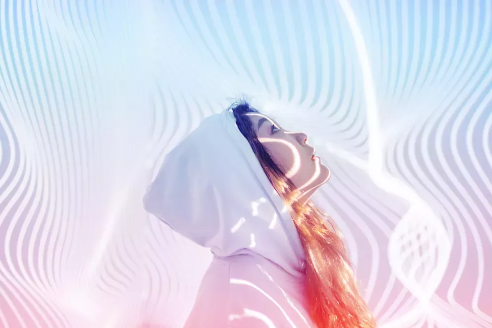 Woman standing in holographic background