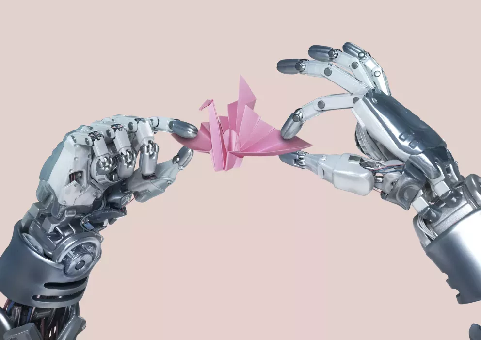 Robot hands holding origami swan Robot hands holding origami swan