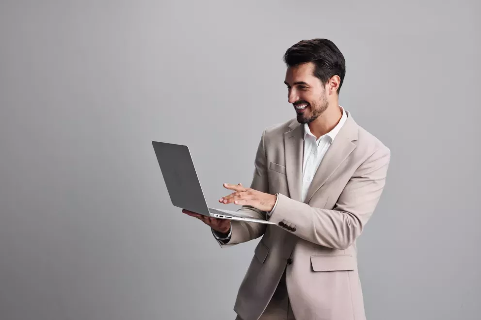 smiling business man looking on laptop smiling business man looking on laptop