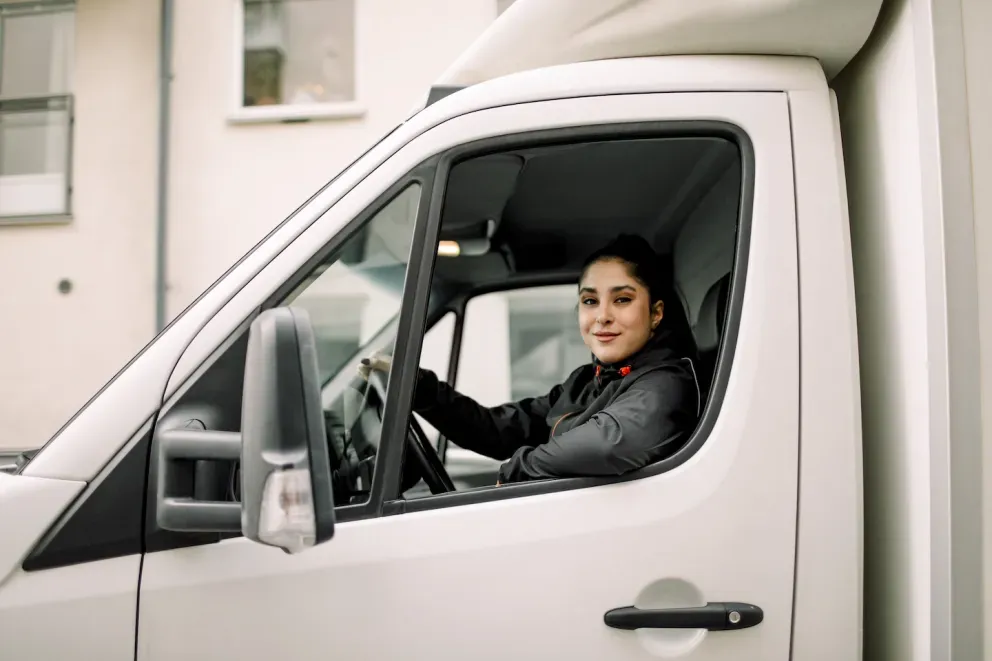 Woman driving a delivery van