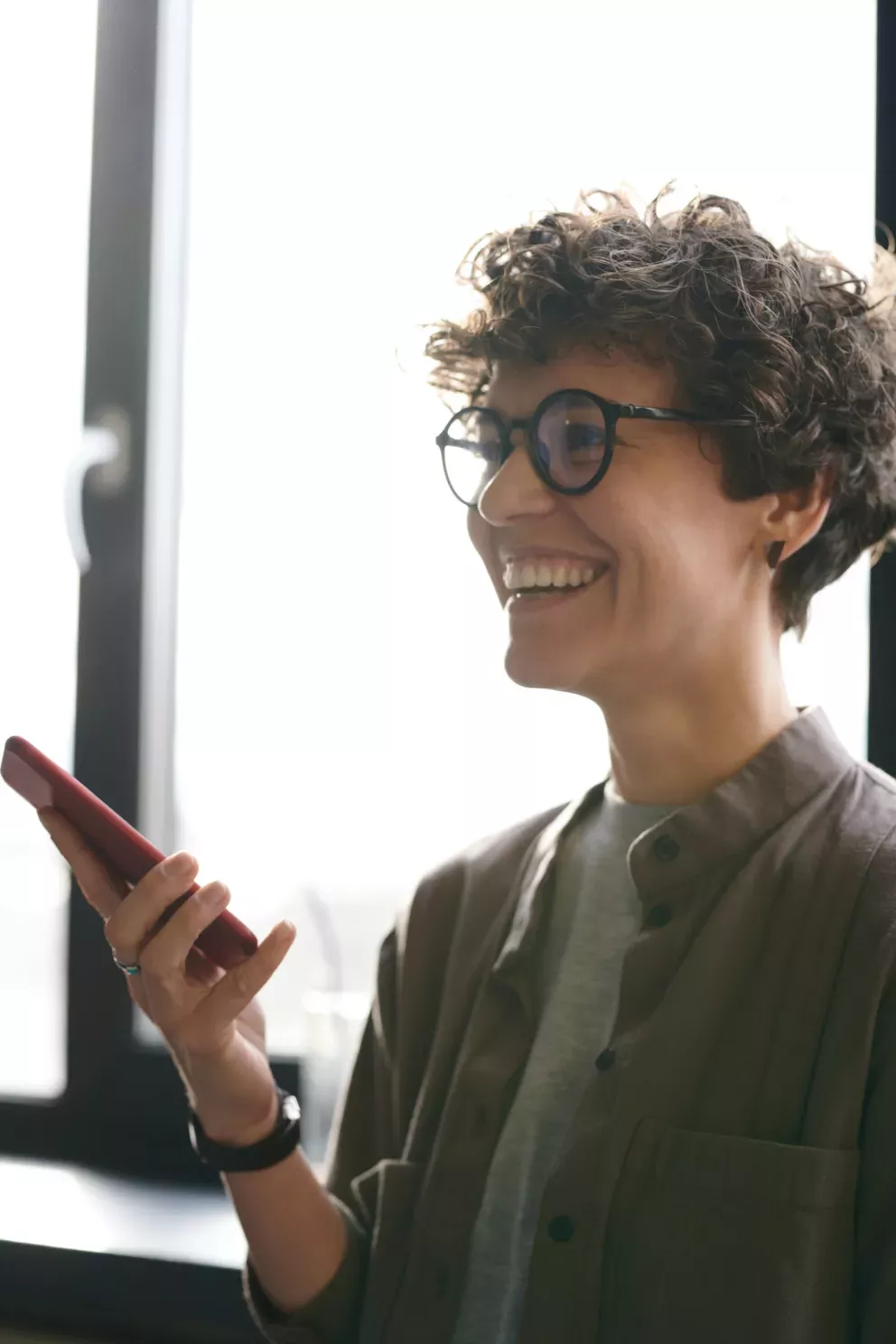 smiling business person talking on cell phone smiling business person talking on cell phone