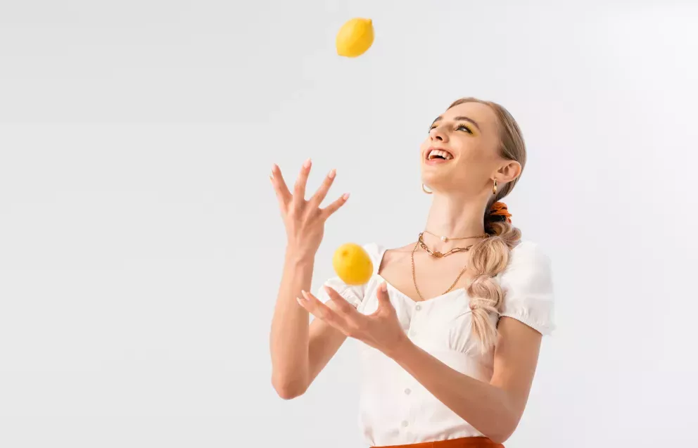 Woman juggling fruit