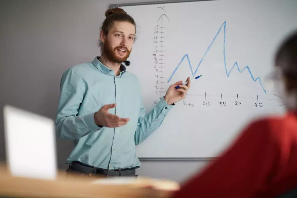 business person showing data business person showing data