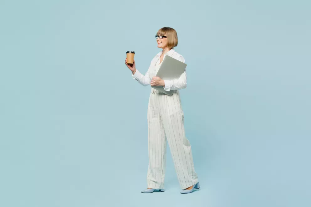 business woman holding laptop and coffee business woman holding laptop and coffee