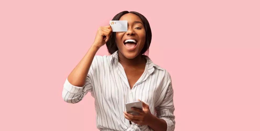 holding credit card over face holding credit card over face