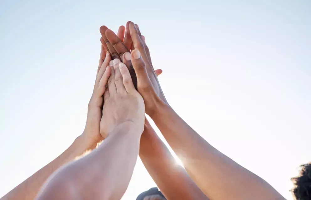group of people giving high five