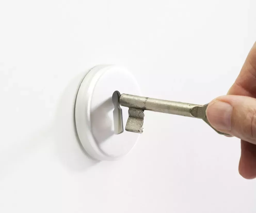 putting key into key hole putting key into key hole
