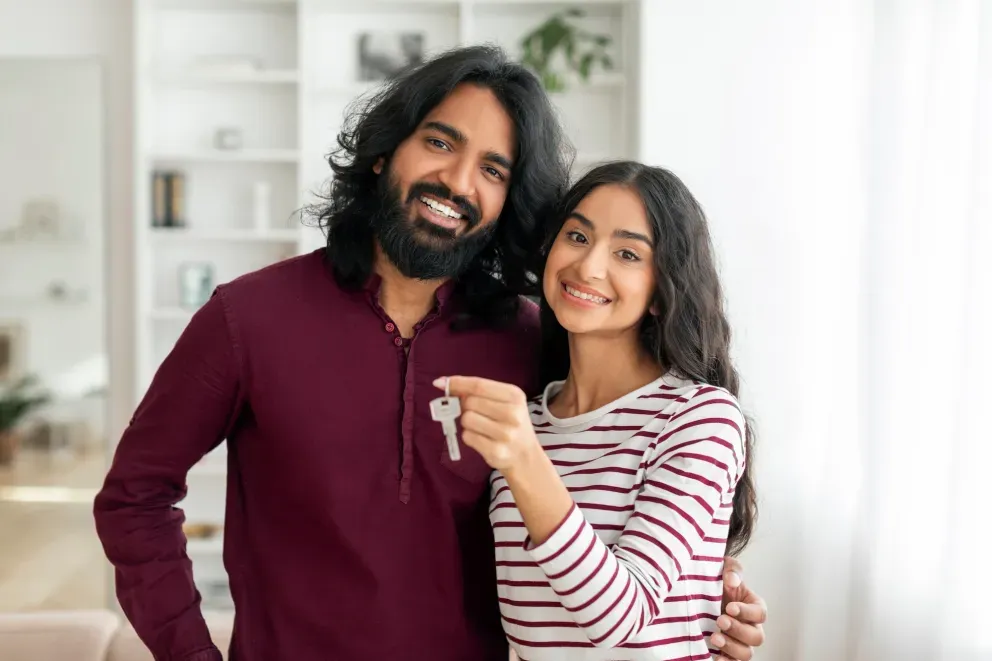 Couple with house keys
