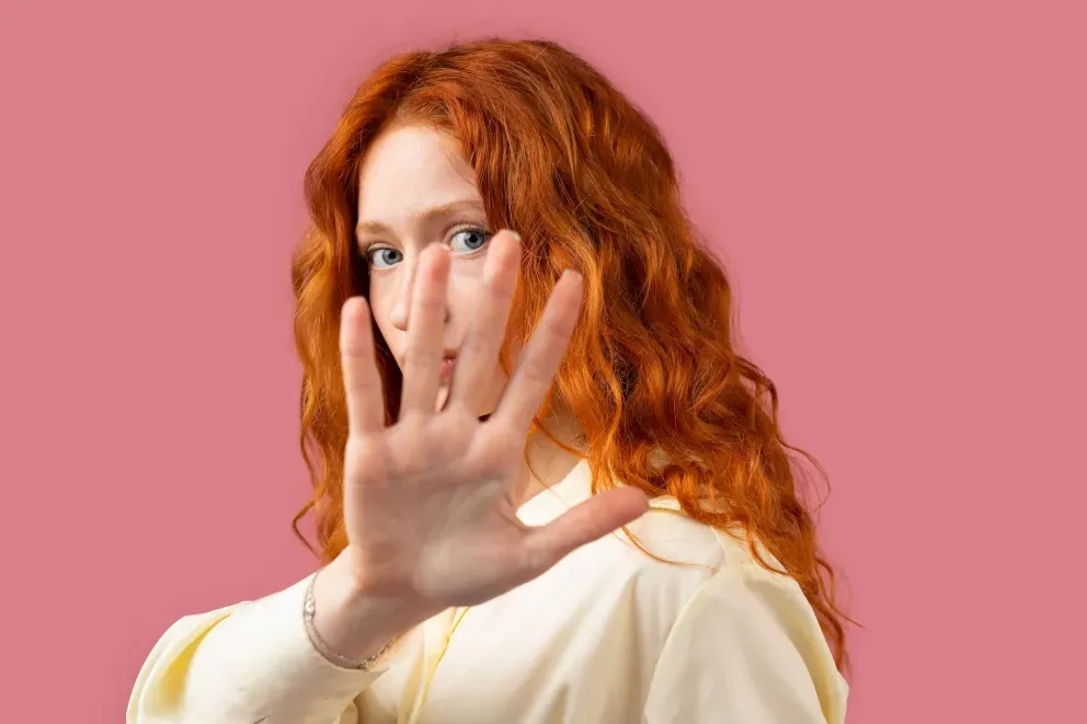 Woman with hand over face