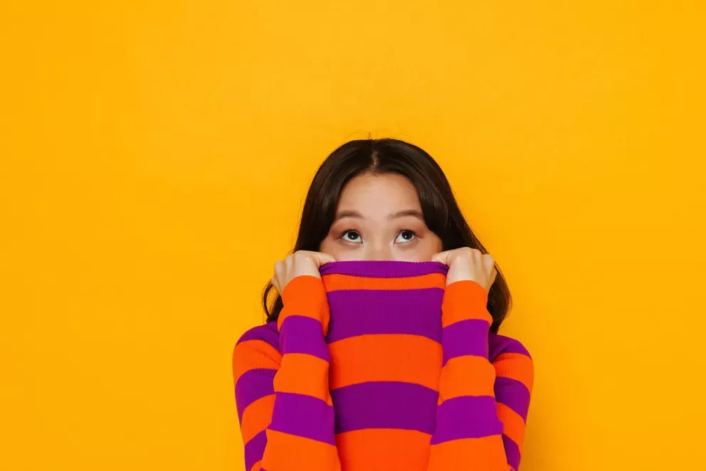 Woman hiding face Woman hiding face