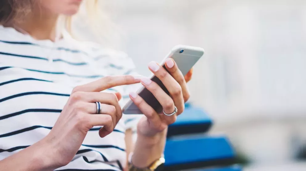 person using mobile phone person using mobile phone