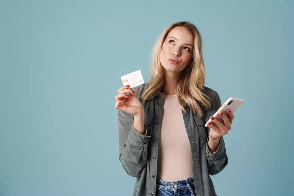 Woman with phone and card Woman with phone and card