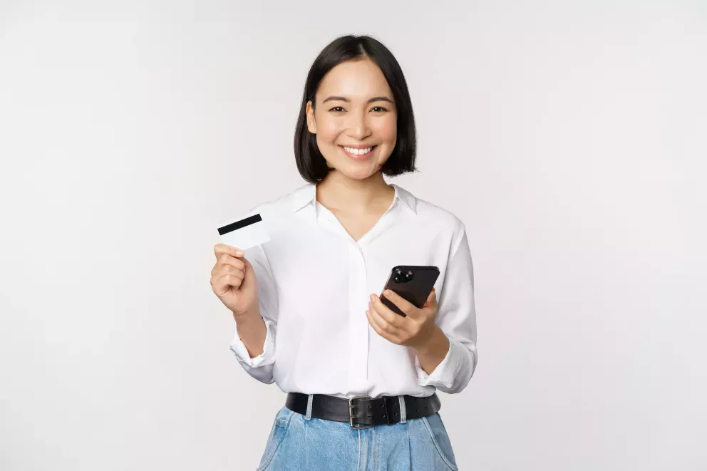 Woman with phone and card Woman with phone and card