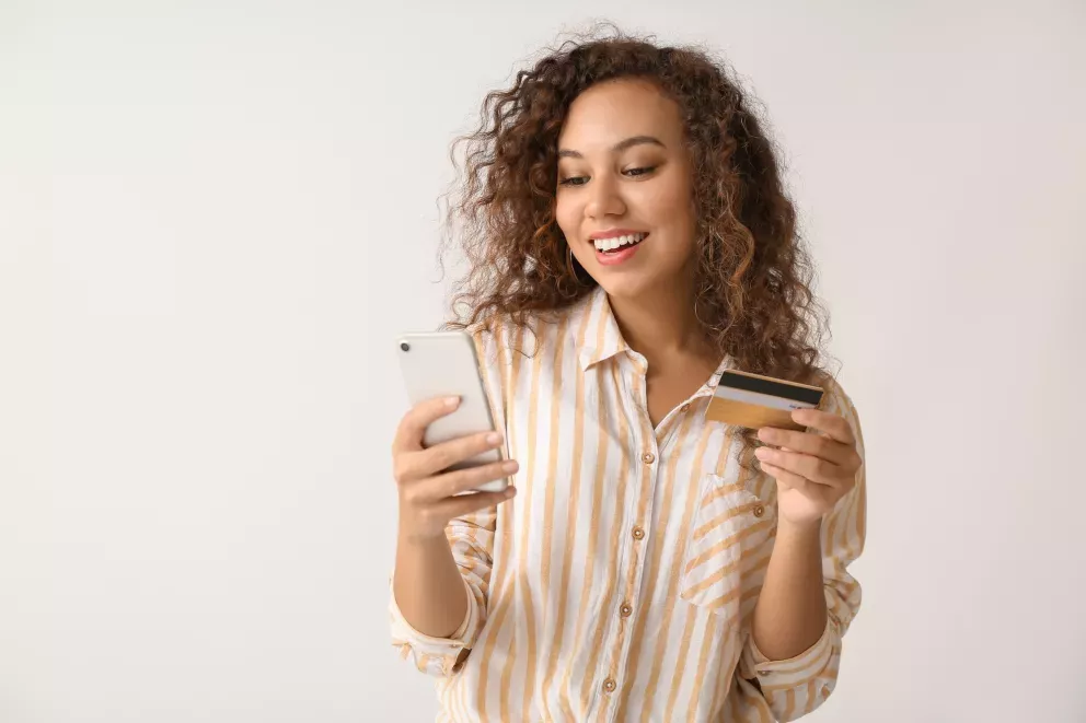 Woman with phone and card Woman with phone and card