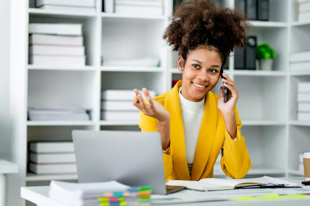 Woman with phone and laptop Woman with phone and laptop