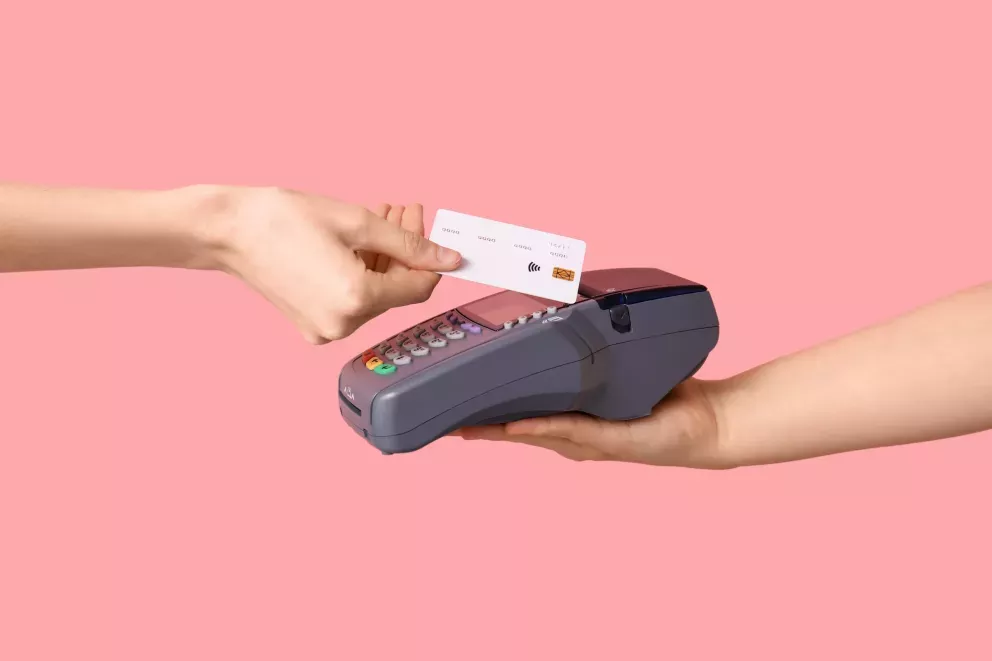 Hand with card and reader