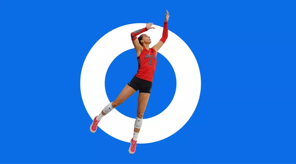 Volley ball player jump hitting in red outfit Volley ball player jump hitting in red outfit