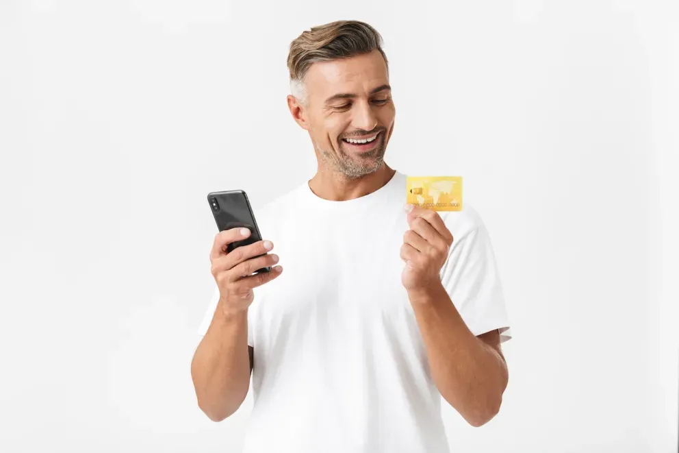 Man with phone and card