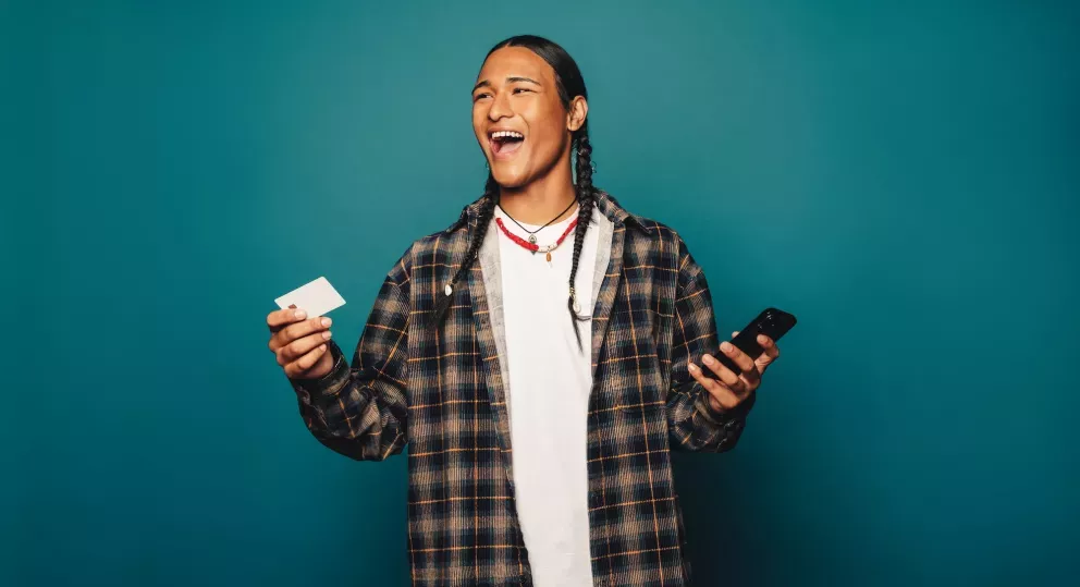 Man with phone and card Man with phone and card