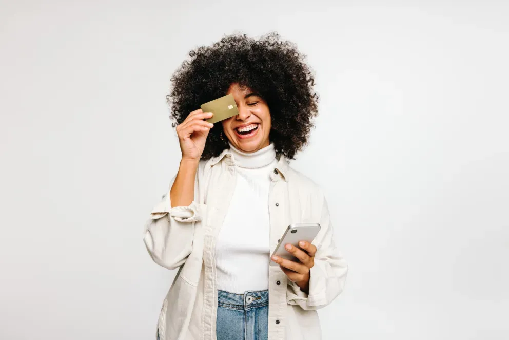 Woman with phone and card