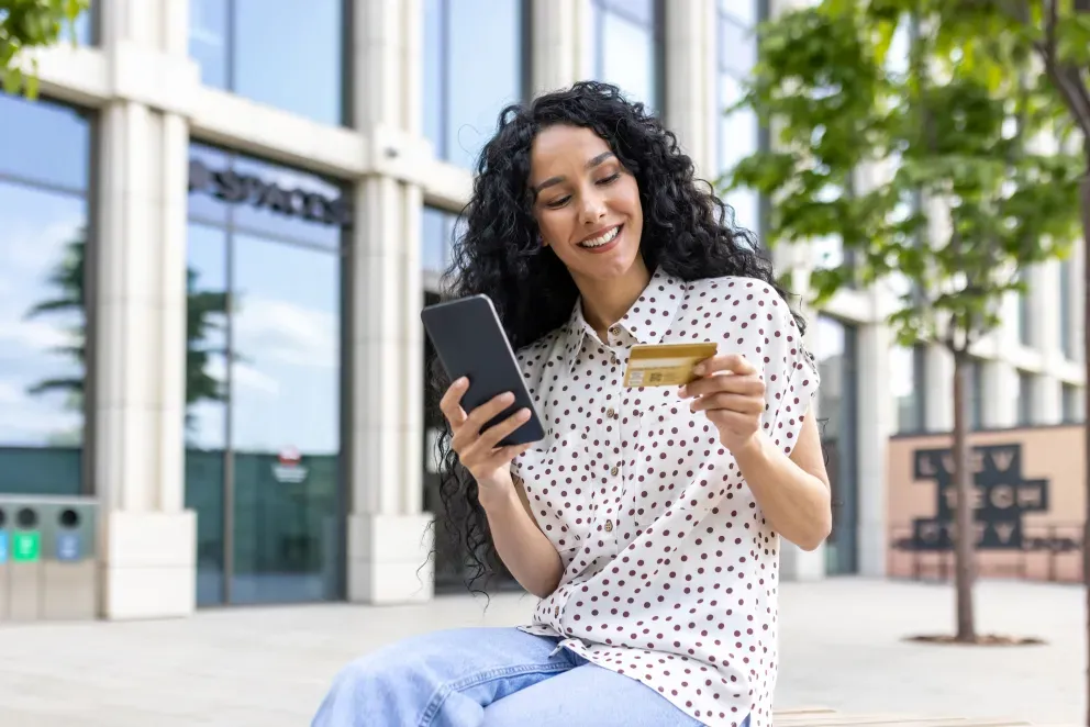 Woman with phone and card Woman with phone and card