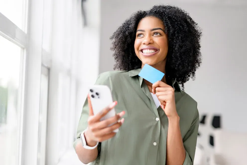 Woman with phone and card Woman with phone and card